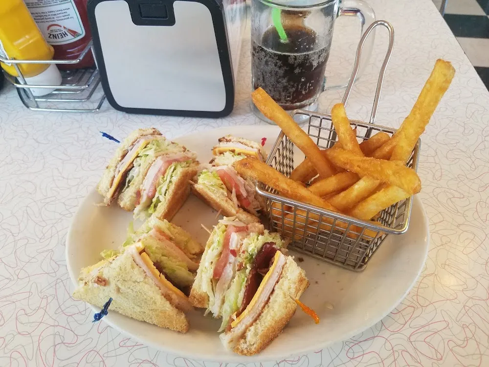 Club Sandwich with a Mini Basket of Fries